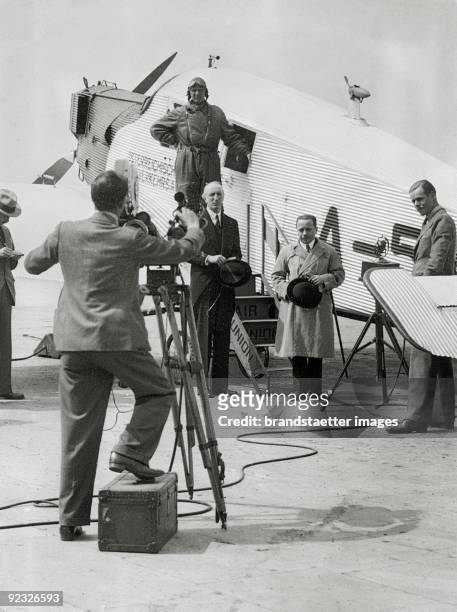 Chancellor Dollfuß together with the Austrian ambassador Frankenstein in front of a aeroplane. Croydon Airport. London. Photograph. June, 16th 1933