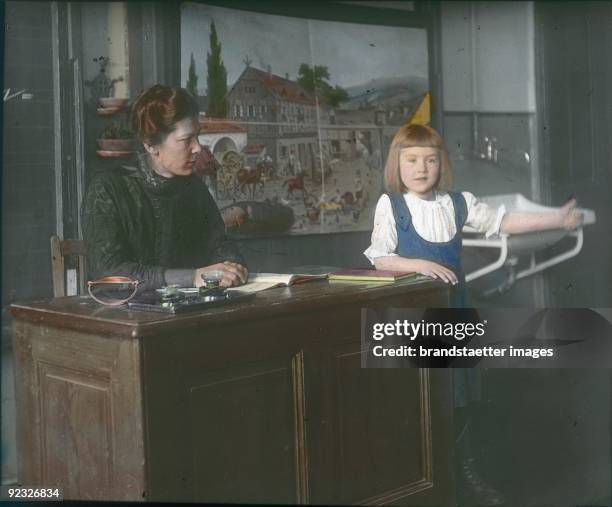 In the classroom. Austria. Hand-colored lantern slide. Around 1910.