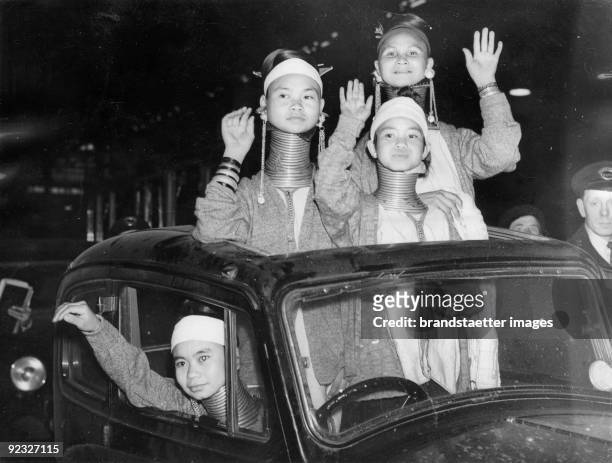 Four Padaung-women from Burma at their arrival in London, Victoria Station. Photograph. England. April 1st 1936.