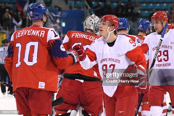 Roman Cervenka of the Czech Republic and Nikita Gusev of Olympic Athlete from Russia shake hands after the Men's Play-offs Semifinals on day fourteen...