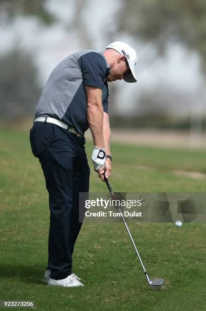 Adam Bland of Australia hits an approach shot during the second round of the Commercial Bank Qatar Masters at Doha Golf Club on February 23, 2018 in...