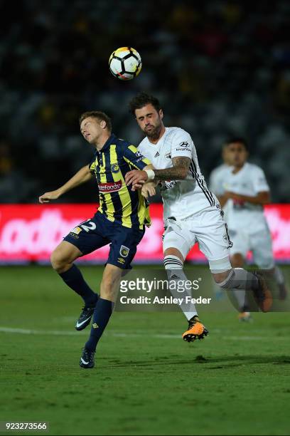 Jacob Melling of the Mariners contests the ball against Thomas Doyle of the Phoenix during the round 21 A-League match between the Central Coast...