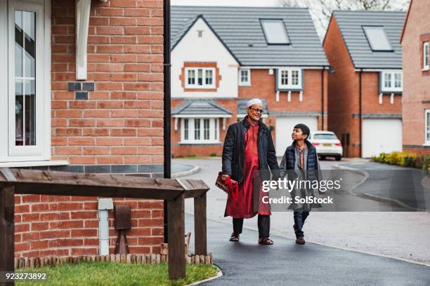 walking with his grandson - daily life in bangladesh stock pictures, royalty-free photos & images