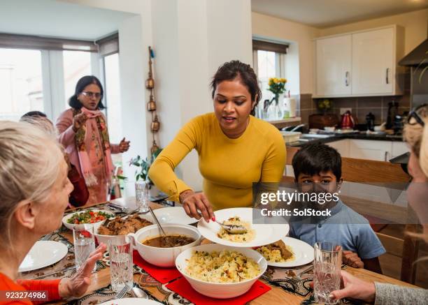 serving dinner - ramadan family stock pictures, royalty-free photos & images