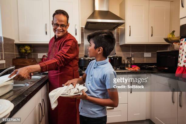 doing the dishes - bangladeshi child stock pictures, royalty-free photos & images