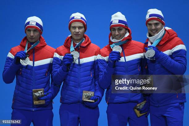 Silver medalists Jan Schmid, Espen Andersen, Jarl Magnus Riiber and Joergen Graabak of Norway celebrate during the medal ceremony for Nordic Combined...