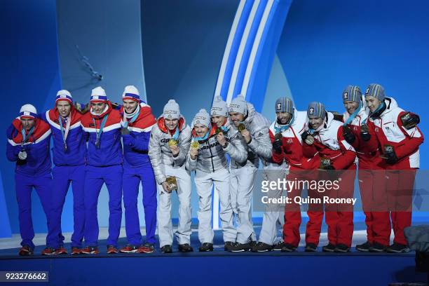 Silver medalists Jan Schmid, Espen Andersen, Jarl Magnus Riiber and Joergen Graabak of Norway, gold medalists Vinzenz Geiger, Fabian Riessle, Eric...