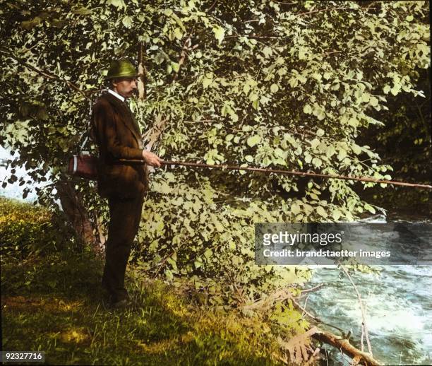 Fisherman angling trouts at the Große Erlauf. Lower Austria. Hand-colored lantern slide. 1909.