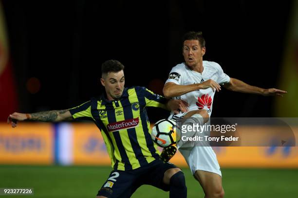 Storm Roux of the Mariners contests the ball with Nathan Burns of the Phoenix during the round 21 A-League match between the Central Coast Mariners...