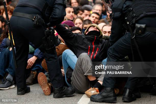 Catalan regional police officers drag a man during a protest called by the 'Commitees in defence of the Republic' to block the TSJC in Barcelona on...