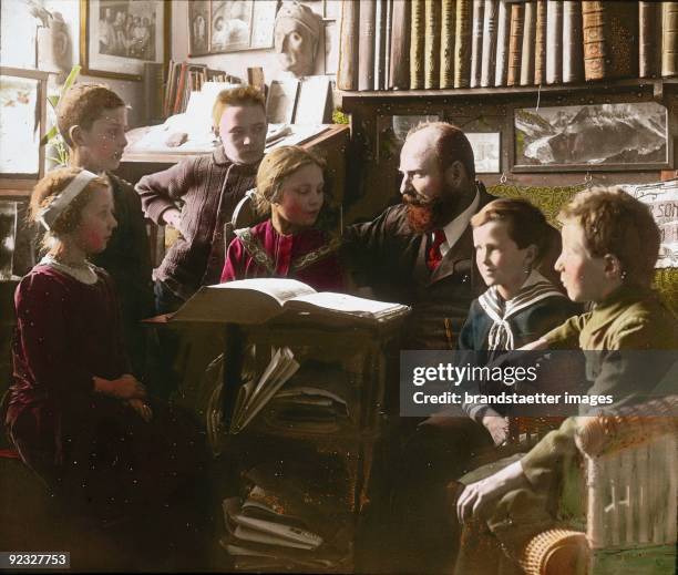 Children listening to a story. Austria. Hand-colored lantern slide. Around 1910.