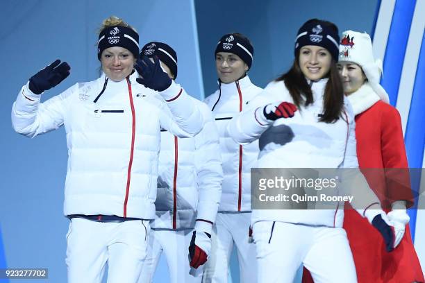 Bronze medalists Anais Chevalier, Marie Dorin Habert, Justine Braisaz and Anais Bescond of France celebrate during the medal ceremony for Biathlon -...