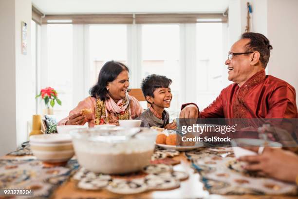 dinner with his grandparents - ramadan food stock pictures, royalty-free photos & images