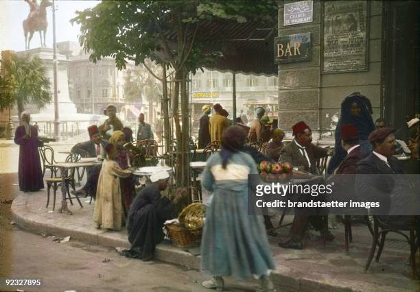 Arabic Peddlers on the Place De L'Opera. Cairo. Egypt. Hand-colored lantern slide. Around 1910.