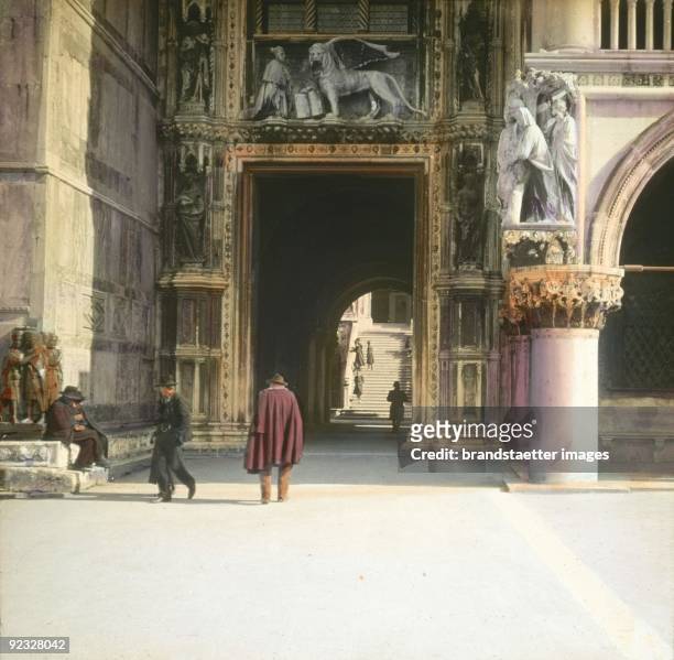 The Porta della Carta of the Doge's Palace . In the background the Golden Staircase. San Marco. Venice. Handcolored lantern slide. Around 1910.