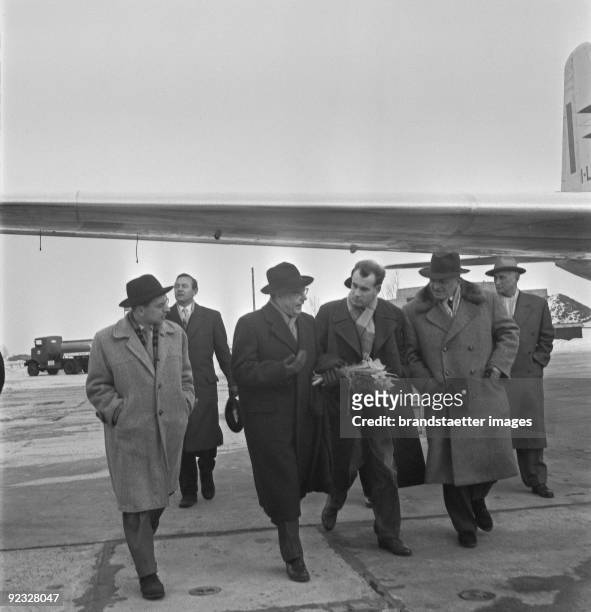 Austrian conductor and director of the Viennese State Opera House Karl Boehm arriving at the airport in Vienna. Right the Journalist Karl Lobl....