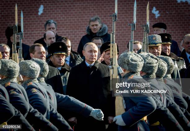 Russian Prime Minister Dmitry Medvedev, Russian President Vladimir Putin and Defence Minister Sergey Shoygu attend a wreath laying ceremony at the...