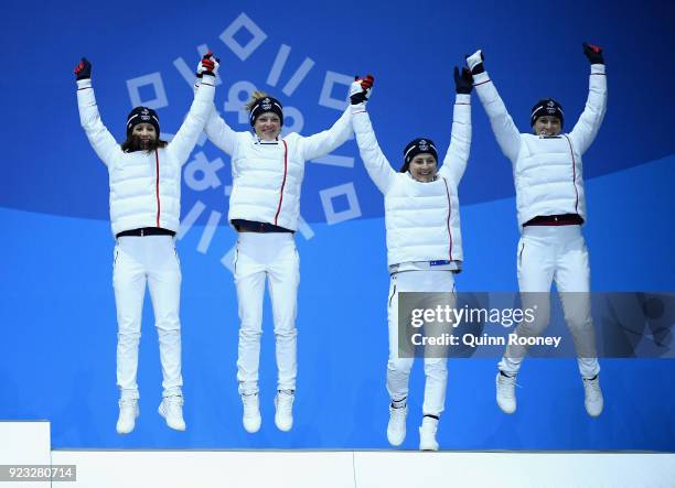 Bronze medalists Anais Chevalier, Marie Dorin Habert, Justine Braisaz and Anais Bescond of France celebrate during the medal ceremony for Biathlon -...