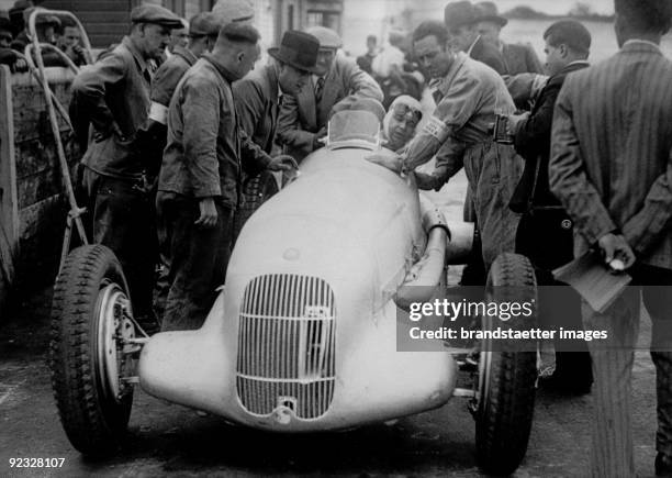 Rudolf Caracciola doing the free practice session at the French Grand Prix de l' ACF with his Alfa Romeo. Montlhery. France. Photograph. July 1934.