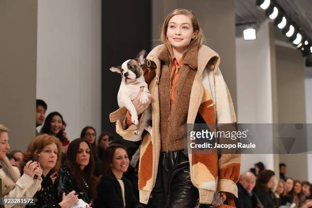 Model Gigi Hadid walks the runway with a dog at the Tod's show during Milan Fashion Week Fall/Winter 2018/19 on February 23, 2018 in Milan, Italy.