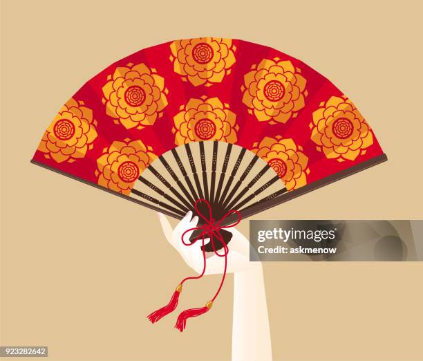 eine hand von geisha hält ein roter fan - geisha stock-grafiken, -clipart, -cartoons und -symbole