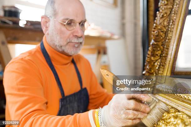 gold leaf and gilding - museum curator stock pictures, royalty-free photos & images