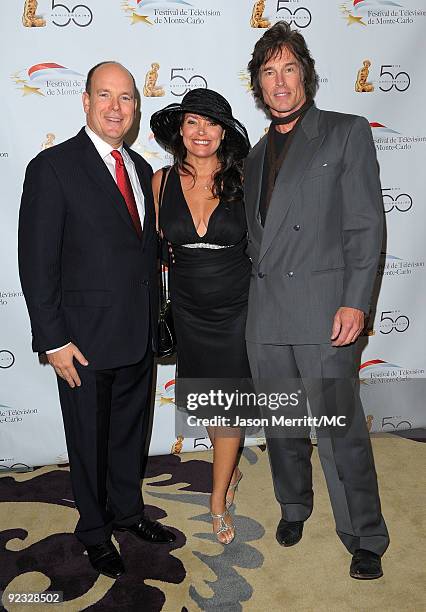 Prince Albert II of Monaco, Devin Devasquez, and actor Ronn Moss attend the Monte Carlo Television Festival cocktail party held at the Beverly Hills...