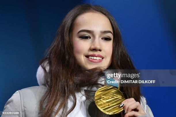 Russia's gold medallist Alina Zagitova poses on the podium during the medal ceremony for the figure skating women's singles at the Pyeongchang Medals...