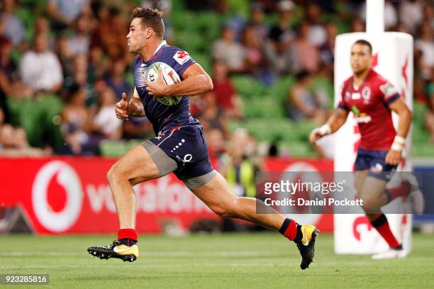 Tom English of the Rebels runs with the ball for a try during the round two Super Rugby match between the Melbourne Rebels and the Queensland Reds at...