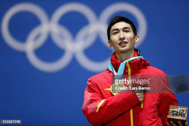 Gold medalist Dajing Wu of China stands on the podium during the medal ceremony for Short Track Speed Skating - Men's 500m on day 14 of the...