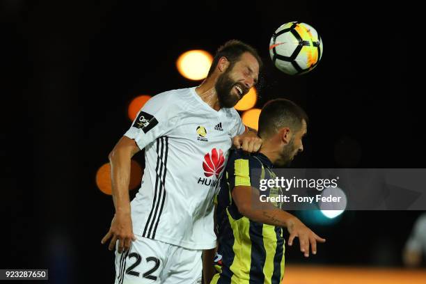 Andrew Durante of the Phoenix contests a header with Petros Skapetis during the round 21 A-League match between the Central Coast Mariners and the...