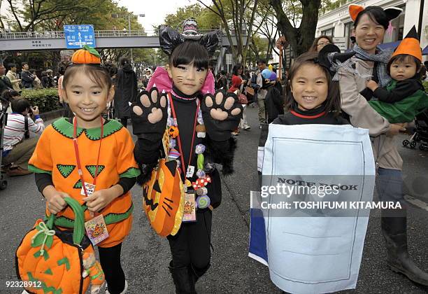 Costumed children join a Halloween parade in Tokyo on October 25, 2009. Some 1,000 children in Halloween costumes took part in the "Harajuku...