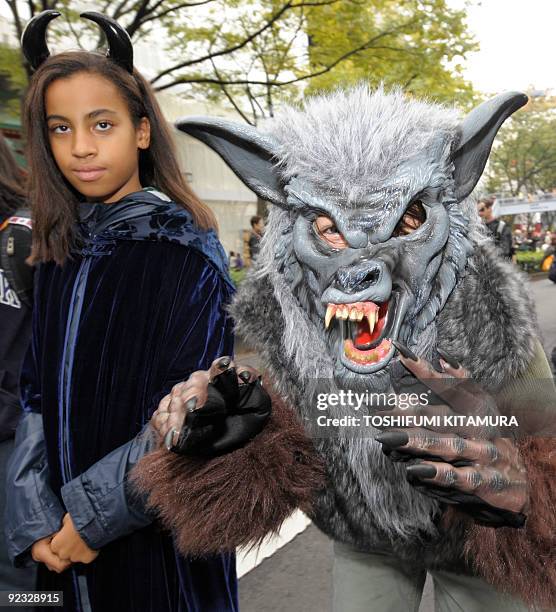 Costumed children join a Halloween parade in Tokyo on October 25, 2009. Some 1,000 children in Halloween costumes took part in the "Harajuku...