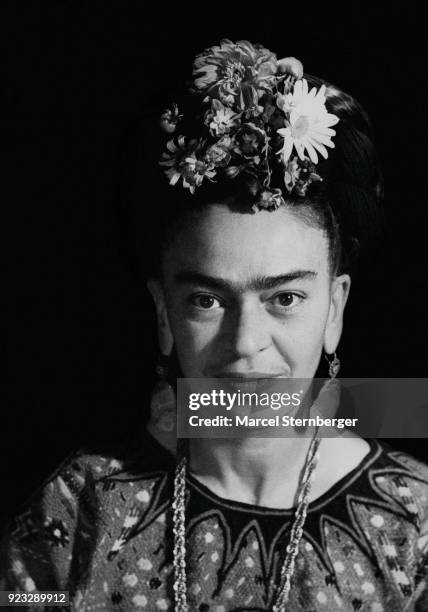 Mexican artist Frida Kahlo wearing flowers in her hair, Mexico City, 1952.