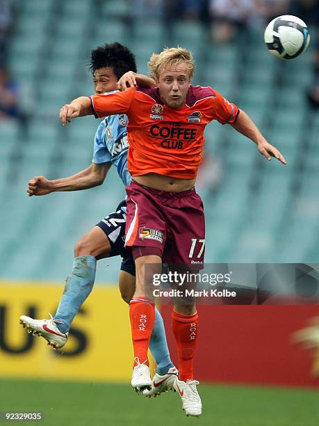 Mitch Nichols of the Roar wins the ball in the air over Sung-Hwan Byun of Sydney FCduring the round 12 A-League match between Sydney FC and the...