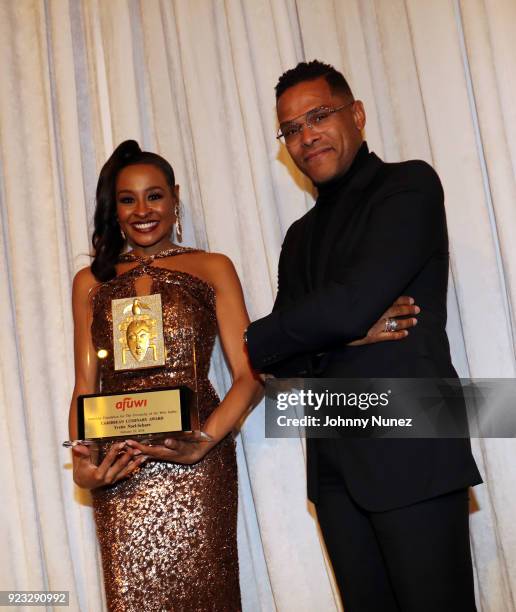 Gala Co-Chair Janell Snowden and recording artist Maxwell appear onstage during the 2018 AFUWI Gala at The Pierre Hotel on February 22, 2018 in New...