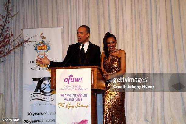 Anchor Maurice DuBois and AFUWI Gala Co-Chair Janell Snowden appear onstage at the 2018 AFUWI Gala at The Pierre Hotel on February 22, 2018 in New...