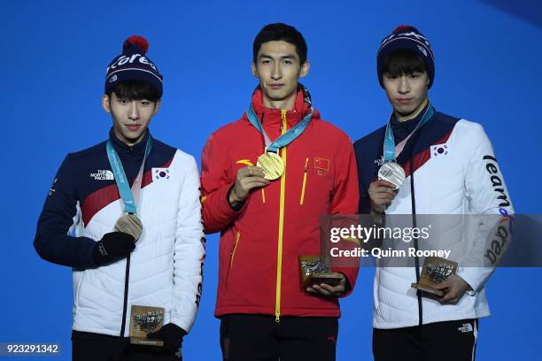 Bronze medalist Hyojun Lim of Korea, gold medalist Dajing Wu of China and silver medalist Daeheon Hwang of Korea stand on the podium during the medal...