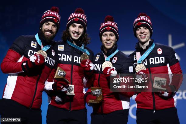 Bronze medalists Samuel Girard, Charles Hamelin, Charle Cournoyer and Pascal Dion of Canada celebrate during the medal ceremony for Short Track Speed...