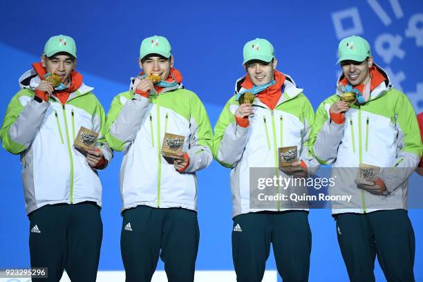 Gold medalists Shaoang Liu, Shaolin Sandor Liu, Viktor Knoch and Csaba Burjan of Hungary celebrate during the medal ceremony for Short Track Speed...