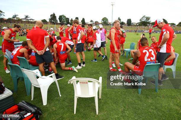 The Swans sit on the field during the halftime break of the AFL Inter Club match between the Sydney Swans and the Greater Western Sydney Giants at...
