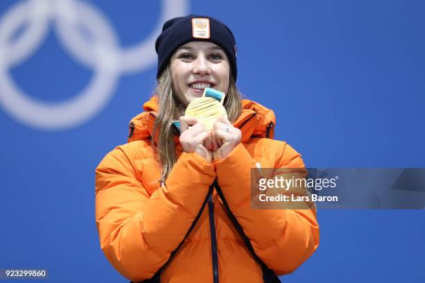 Gold medalist Suzanne Schulting of the Netherlands celebrates during the medal ceremony for Short Track Speed Skating - Ladies' 1,000m on day 14 of...
