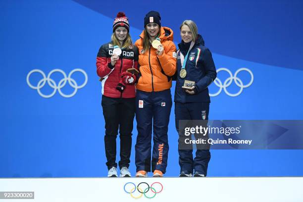 Silver medalist Kim Boutin of Canada, gold medalist Suzanne Schulting of the Netherlands and bronze medalist Arianna Fontana of Italy celebrate...