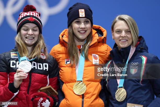 Silver medalist Kim Boutin of Canada, gold medalist Suzanne Schulting of the Netherlands and bronze medalist Arianna Fontana of Italy celebrate...