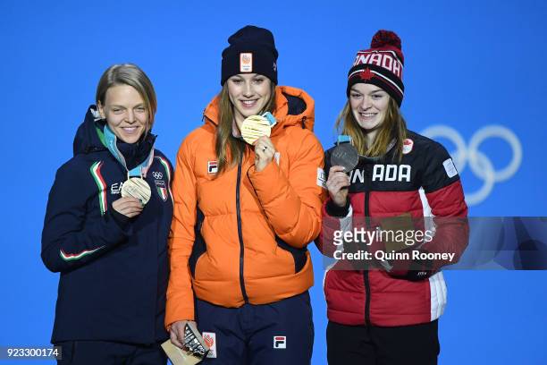 Bronze medalist Arianna Fontana of Italy, gold medalist Suzanne Schulting of the Netherlands and silver medalist Kim Boutin of Canada celebrate...