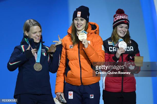 Bronze medalist Arianna Fontana of Italy, gold medalist Suzanne Schulting of the Netherlands and silver medalist Kim Boutin of Canada celebrate...
