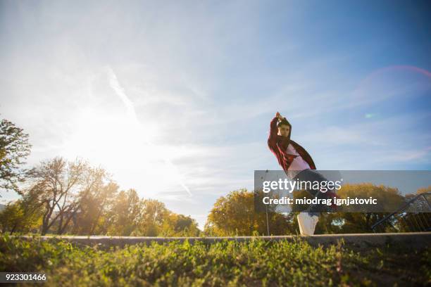 young men street dancing in a natural park - only young men stock pictures, royalty-free photos & images