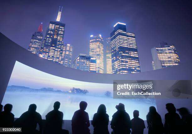 illuminated skyline with outdoor cinema, showing beautiful landscape - public building stock photos et images de collection