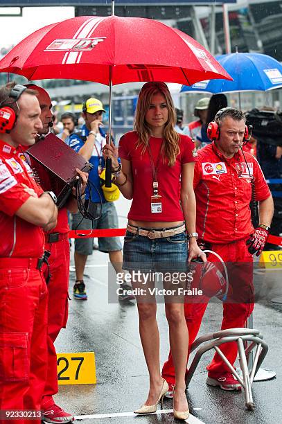 Casey Stoner's wife Adriana Tuchyna wait for her husband at the grid before the start of the Malaysian MotoGP, which is round 16 of the MotoGP World...