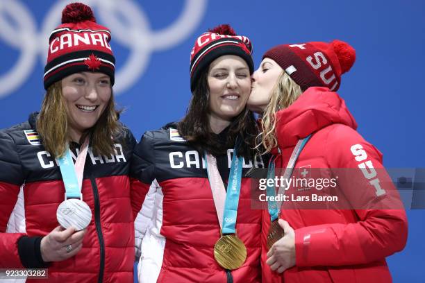 Silver medalist Brittany Phelan of Canada, gold medalist Kelsey Serwa of Canada and bronze medalist Fanny Smith of Switzerland celebrate during the...